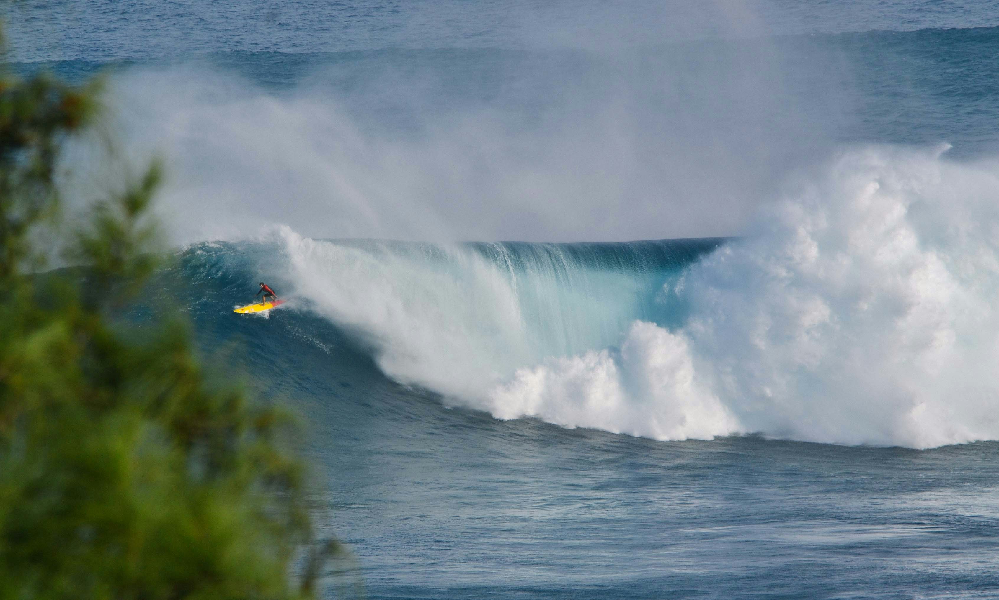 man surfing on clear wave sea